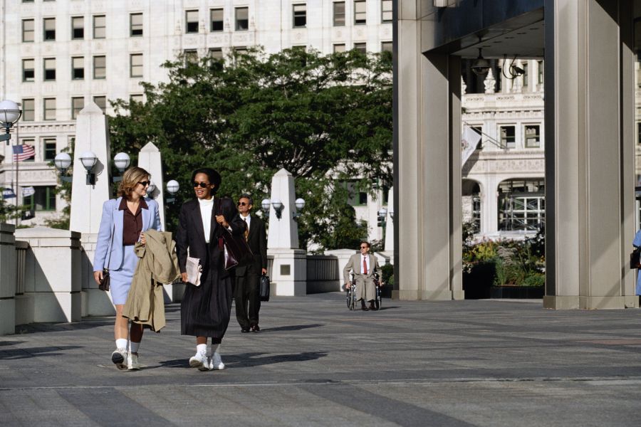 two women walking in city